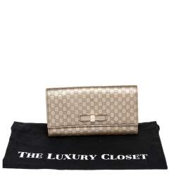 مملوكة مسبقًا محفظة غوتشي كونتينينتال جلد مايكروغوتشيسيما ذهبي بفيونكة وقلاب