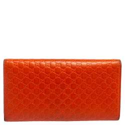 مملوكة مسبقًا محفظة كونتيننتال غوتشي جلد مايكروغوتشيسيما برتقالي ثلاثية الطي