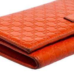 مملوكة مسبقًا محفظة كونتيننتال غوتشي جلد مايكروغوتشيسيما برتقالي ثلاثية الطي