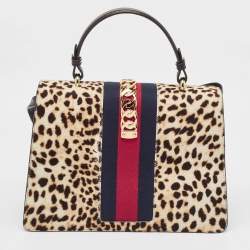 Pre Owned Gucci Beige/Black Leopard Print Calfhair and Leather Medium Sylvie Top Handle Bag