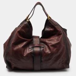 مملوكة مسبقًا Gucci Two Tone Burgundy Leather Stirrup Shoulder Bag