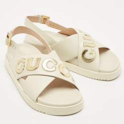 Pre Owned Gucci Off White Leather Logo Ankle Strap Flat Sandals 38.5