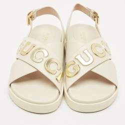 Pre Owned Gucci Off White Leather Logo Ankle Strap Flat Sandals 38.5