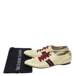 Pre Owned حذاء رياضي غوتشي منخفض من أعلي و برباط علوي و مزين بشريط ويب جلد لامع أصفر مقاس 38.5