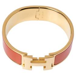 Pre Owned Hermes Clic Clac H Orange Enamel Gold Plated Wide Bracelet PM