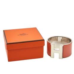 Pre Owned Hermes Clic Clac H Orange Enamel Palladium Plated Extra Wide Bracelet PM