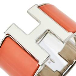 Pre Owned Hermes Clic Clac H Orange Enamel Palladium Plated Extra Wide Bracelet PM