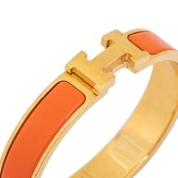 Pre Owned Hermès Clic H Orange Enamel Gold Plated Narrow Bracelet PM