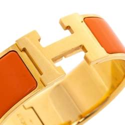 Pre Owned Hermès Clic Clac H Orange Enamel Gold Plated Wide Bracelet PM