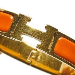 Pre Owned Hermès Clic H Orange Enamel Gold Plated Narrow Bracelet PM