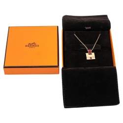 Pre Owned Hermes Eileen Red Enamel Gold Tone Metal Pendant