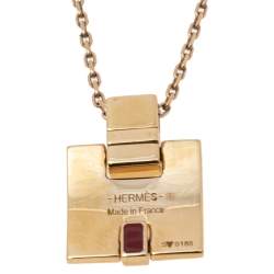 Pre Owned Hermes Eileen Red Enamel Gold Tone Metal Pendant