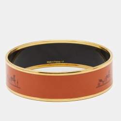 Pre Owned Hermes Wide Orange Enamel Gold Tone Metal Bangle Bracelet