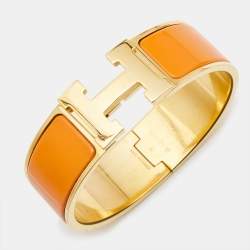 Pre Owned Hermès Clic Clac H Orange Enamel Gold Plated Wide Bracelet 