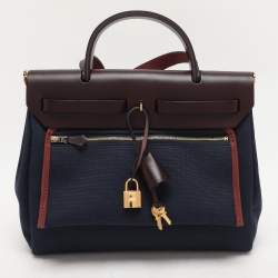 Pre Owned Hermès Navy Blue/Brown Toile Canvas and Leather Herbag Zip 31 Bag