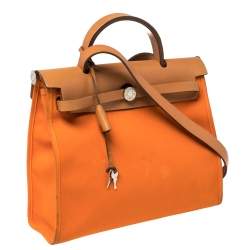 Pre Owned Hermes Orange/Natural Canvas and Leather Herbag Zip 31 Bag