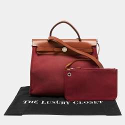 Pre Owned Hermes Ruby/Fauve Canvas and Leather Herbag Zip 31 Bag