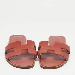 مملوكة مسبقًا صندل هيرمس أوران جلد سحلية وردي مسطح مقاس 37.5