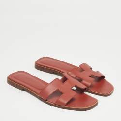 مملوكة مسبقًا صندل هيرمس أوران جلد سحلية وردي مسطح مقاس 37.5