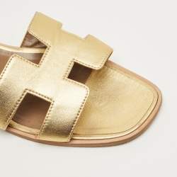 Pre Owned حذاء سلايد مسطح هيرمس أوران جلد ذهبي مقاس 42