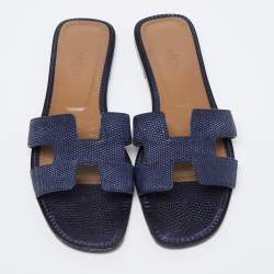 مملوكة مسبقًا صندل سلايد هيرمس أوران فلات جلد سحل�ية أزرق كحلي مقاس 39.5