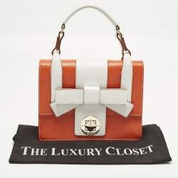 Pre Owned حقيبة يد جلد برتقالي/أبيض مع قفل فيونكة كيت سبيد