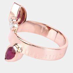Pre Owned خاتم بتصميم بايباس من روبي وماس وزن 1.21 قيراط من الذهب الوردي عيار 14 بحجم 7 US