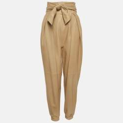 Pre Owned بنطلون كريستينا فيدلسكايا جلد بيج مطوي بمقاس صغير جدًا (إكس سمول)