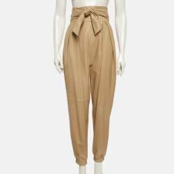 Pre Owned بنطلون كريستينا فيدلسكايا جلد بيج مطوي بمقاس صغير جدًا (إكس سمول)