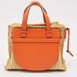 ممل وكة مسبقًا حقيبة يد لويفي غيت متوسطة من الرافيا والجلد برتقالية/طبيعية