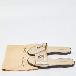 Pre Owned Louis Vuitton Gold Ostrich Leather Lock It Flat Sandals Size 38