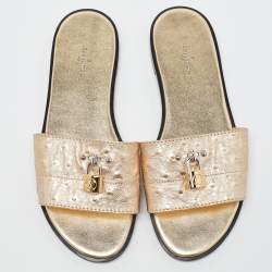Pre Owned Louis Vuitton Gold Ostrich Leather Lock It Flat Sandals Size 38
