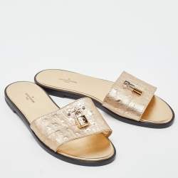 Pre Owned Louis Vuitton Gold Ostrich Leather Lock It Flat Sandals Size 38