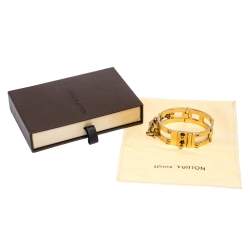 Pre Owned Louis Vuitton Lock Me Frame Gold Tone Cuff Bracelet