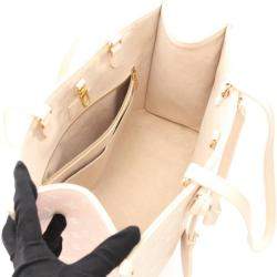 Pre Owned Louis Vuitton OnTheGo MM Rose Beige Monogram Empreinte Leather Tote Bag