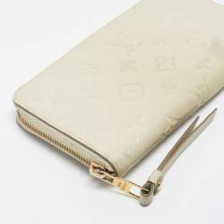 Pre Owned Louis Vuitton Off White Monogram Empreinte Leather Zippy Wallet
