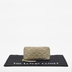 Pre Owned Louis Vuitton Off White Monogram Empreinte Leather Zippy Wallet