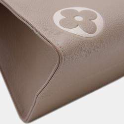 Pre Owned Louis Vuitton On the Go MM Tourterelle Creme Monogram Empreinte Leather Tote Bag