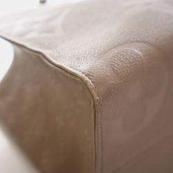 Pre Owned Louis Vuitton Brown Monogram Empreinte OnTheGo MM
