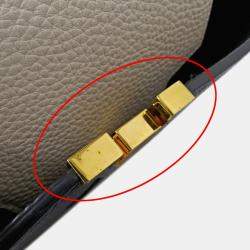 Pre Owned حقيبة لوي فيتون كابوسينز MM جلد توريلون أسود/كريم/غال أسود