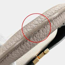 Pre Owned حقيبة لوي فيتون كابوسينز MM جلد توريلون أسود/كريم/غال أسود