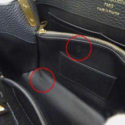 Pre Owned حقيبة لوي فيتون كابوسينز MM جلد توريلون أسود/كريم/غال أسود