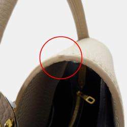 Pre Owned حقيبة لوي فيتون كابوسينز MM جلد توريلون أسود/كريم/غال أسود