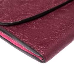 مملوكة مسبقًا محفظة لوي فيتون "ايميلي" جلد مطبوع مونوغرامي عنابي