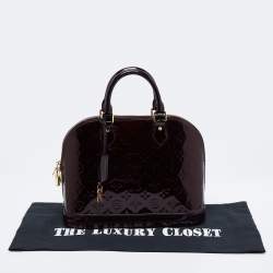 مملوكة مسبقًا حقيبة لوي فيتون ألما جلد لامع مونوغرامي عنابي متوسطة