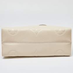 Pre Owned Louis Vuitton Creme Monogram Empreinte Leather Onthego GM Bag