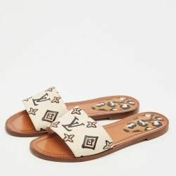 Pre Owned Louis Vuitton Cream Monogram Embossed Leather Revival Flat Slides Size 37