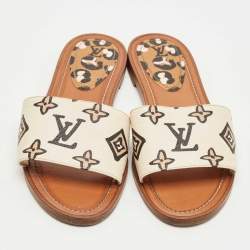 Pre Owned Louis Vuitton Cream Monogram Embossed Leather Revival Flat Slides Size 37