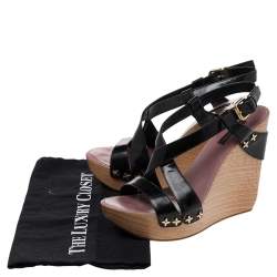 مملوكة مسبقًا صندل لوي فيتون جلد أسود لامع سير كاحل نعل سميك كعب روكي سيور متعاكسة مقاس 38.5