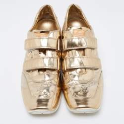 مملوكة مسبقًا Louis Vuitton Metallic Gold Monogram Empreinte Leather Sneakers Size 40.5